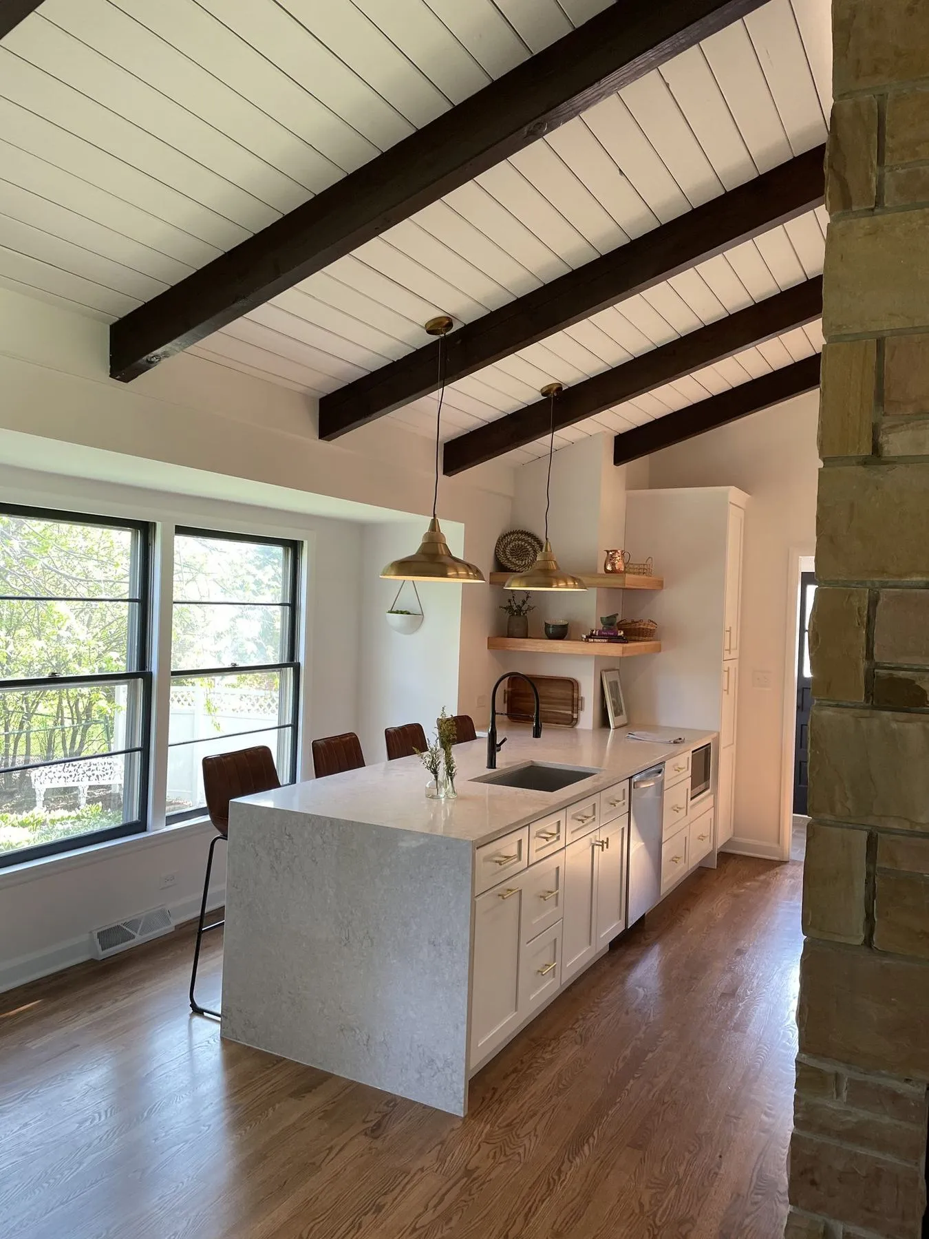 Beamed kitchen with a waterfall island