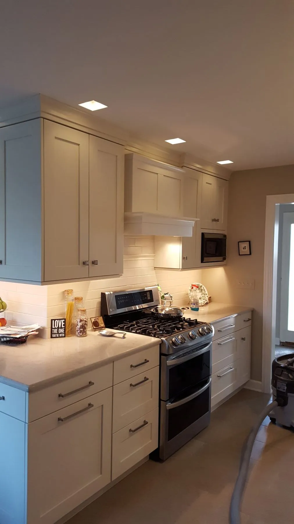 White cabinets and a stainless range
