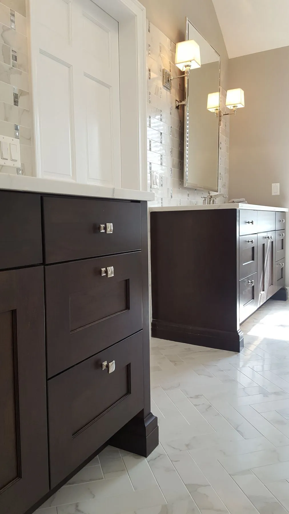 Vanity drawers and marble herringbone floor