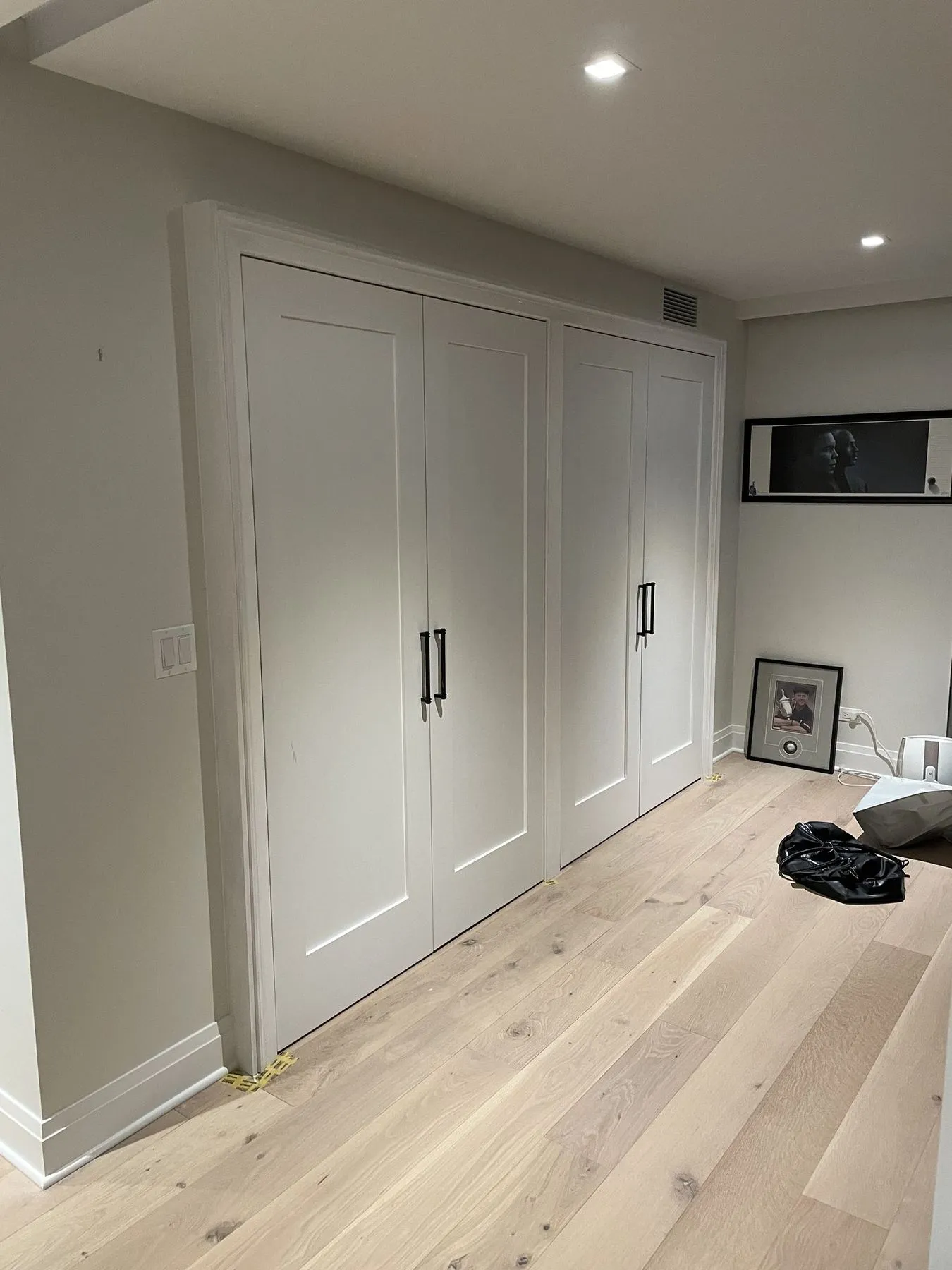 Built-in closet doors with black pulls