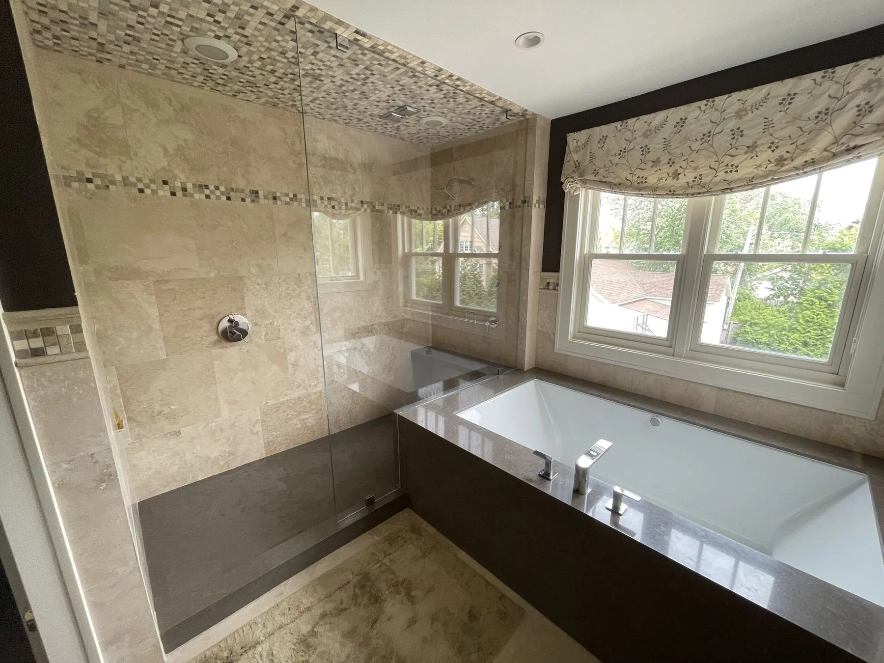 Soaking tub with a pebble mosaic ceiling above