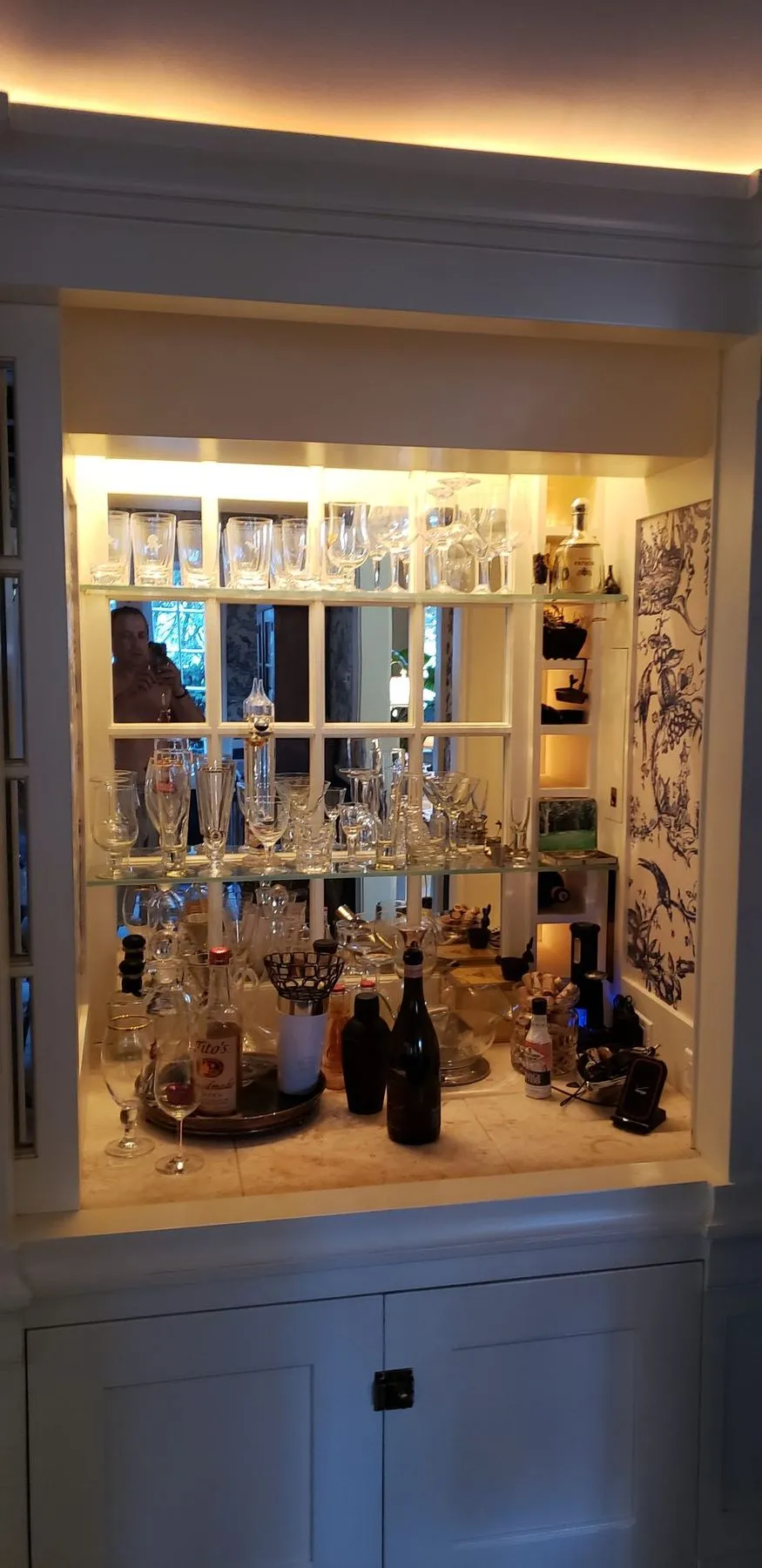 Lit bar cabinet with glass shelves