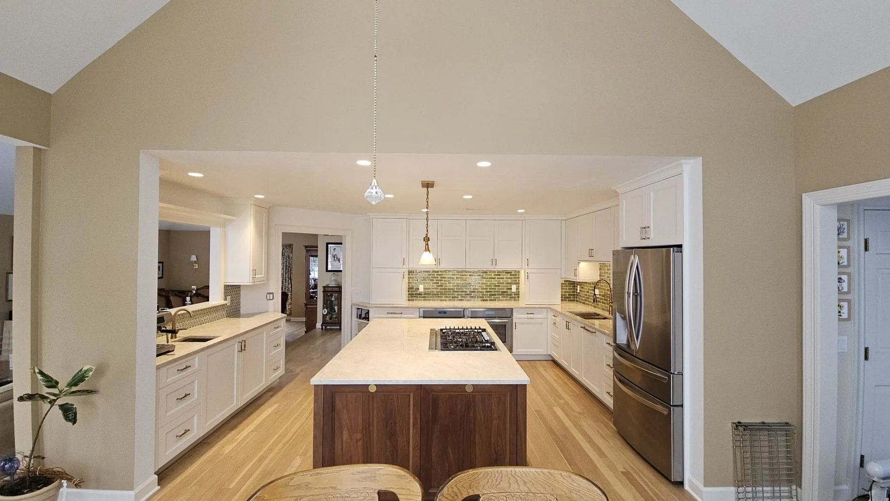 Wide view of the kitchen through a cased opening from the next room